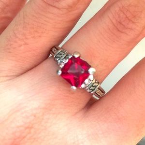 Garnet ring with simulated diamond at the sides